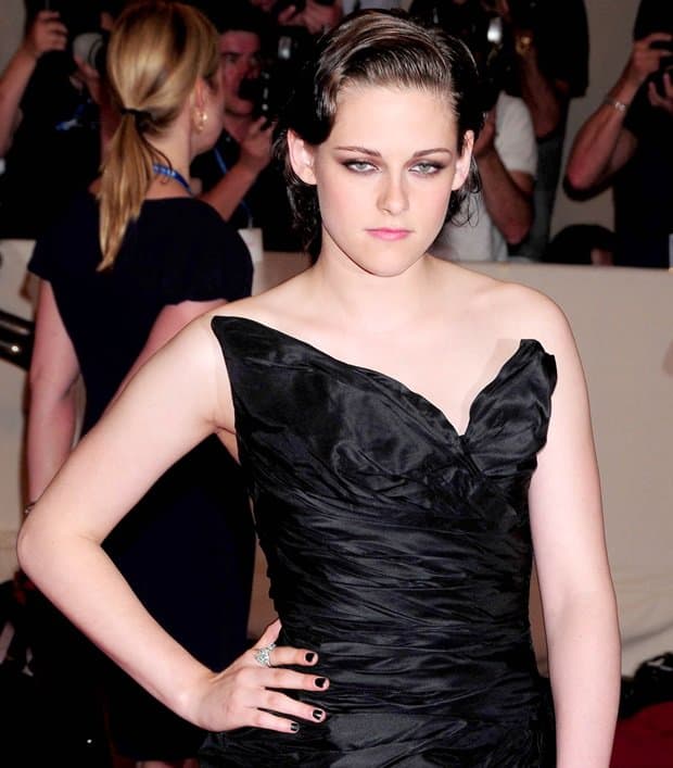 Kristen Stewart shines in a black taffeta asymmetrical Chanel Spring 2008 Couture dress at The Metropolitan Museum of Art's 'American Woman: Fashioning a National Identity' exhibition gala