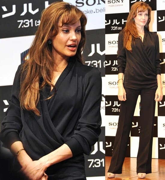 In a chic black ensemble, Angelina Jolie commands attention at the 'Salt' press conference, Tokyo Grand Hyatt, July 27, 2010