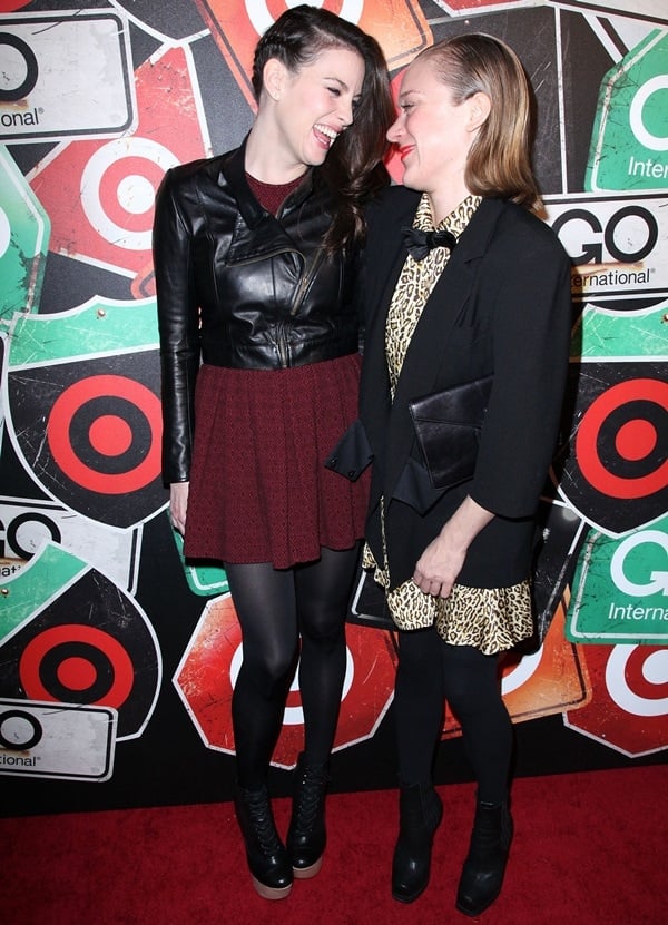 Liv Tyler and Chloe Sevigny pose for photos together on the red carpet