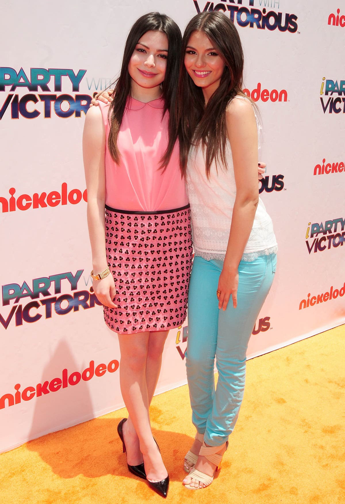 Miranda Cosgrove and Victoria Justice attend Nickelodeon's "iParty With Victorious" screening at The Lot on June 4, 2011, in West Hollywood, California, looking stylish in coordinated yet distinct outfits