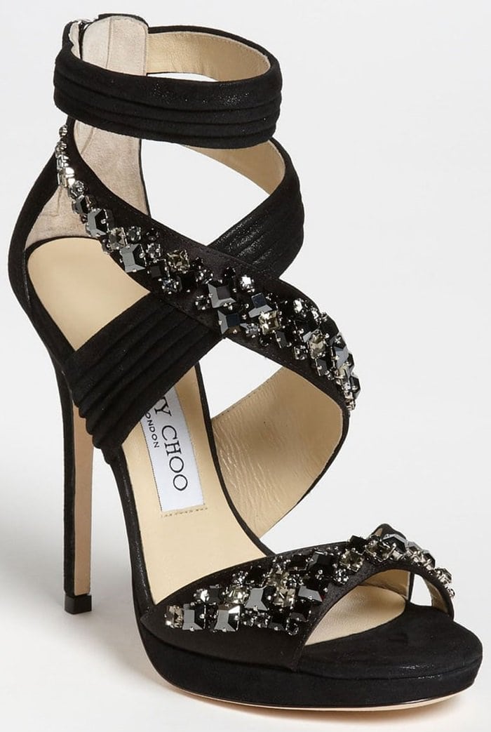 Shimmery suede swathes a dazzling, crystal-drenched sandal perched atop a slim heel