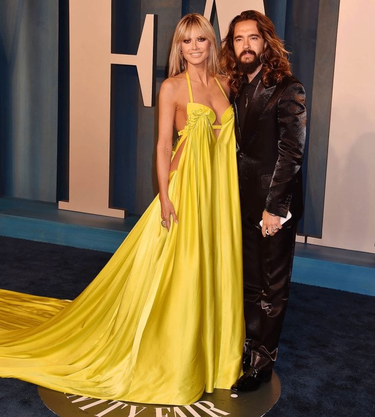 Heidi Klum Shocks in Yellow Breast Pump Dress at Oscar Party