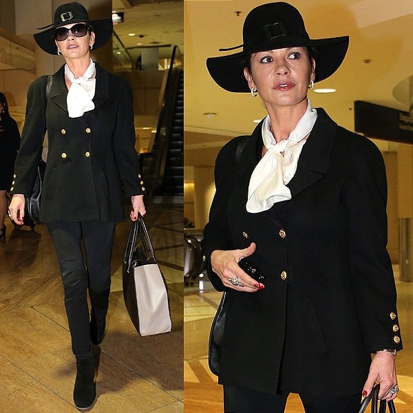 Catherine Zeta Jones is in a world of her own in this witch hat-topped ensemble