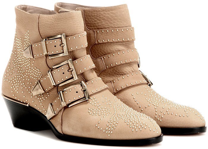 Utilitarian buckles are accentuated with speckled studs that make these boots the epitome of edge