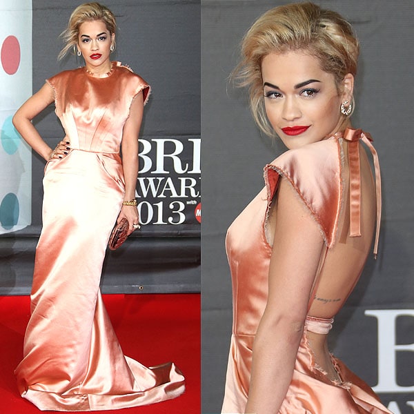 Rita Ora wearing a peachy rose Ulyana Sergeenko Couture gown and a custom made snake ring by Jennifer Fisher