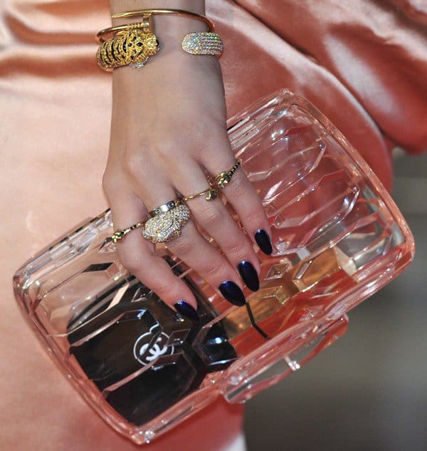 Rita Ora carrying a Gucci Spring 2013 perspex clutch