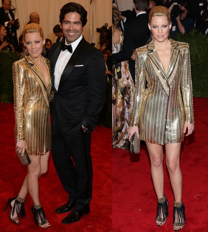 Elizabeth Banks posing with shoe designer Brian Atwood on the red carpet at the 2013 Met Gala held at the Metropolitan Museum of Art in New York City on May 6, 2013