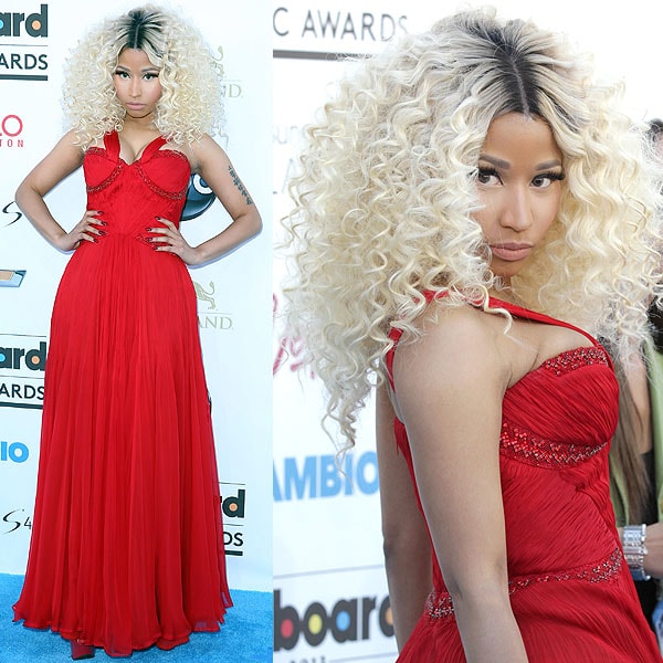 Nicki Minaj surprises with a playful twist, sporting red heel-less slingbacks, adding a unique flair to her ensemble at the 2013 Billboard Music Awards