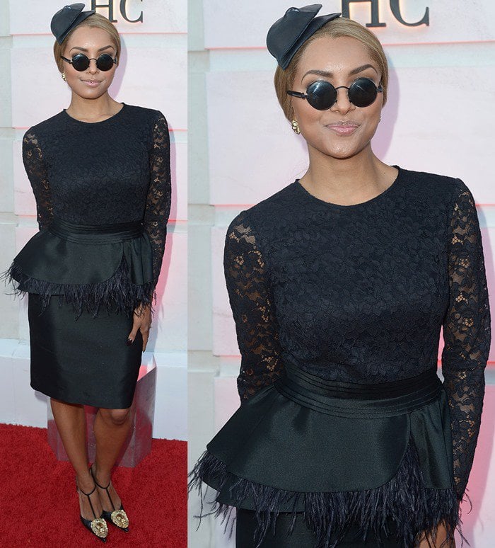 Katerina Graham wears a black feathery look with a fascinator to the opening of the Beverly Hills Carolina Herrera store