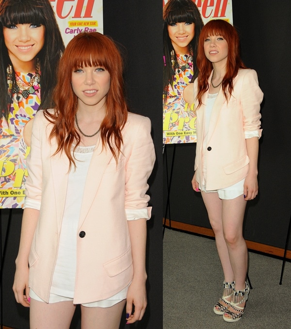 Carly wore teeny white shorts with a white tank layered beneath a pearly pink Smyth jacket
