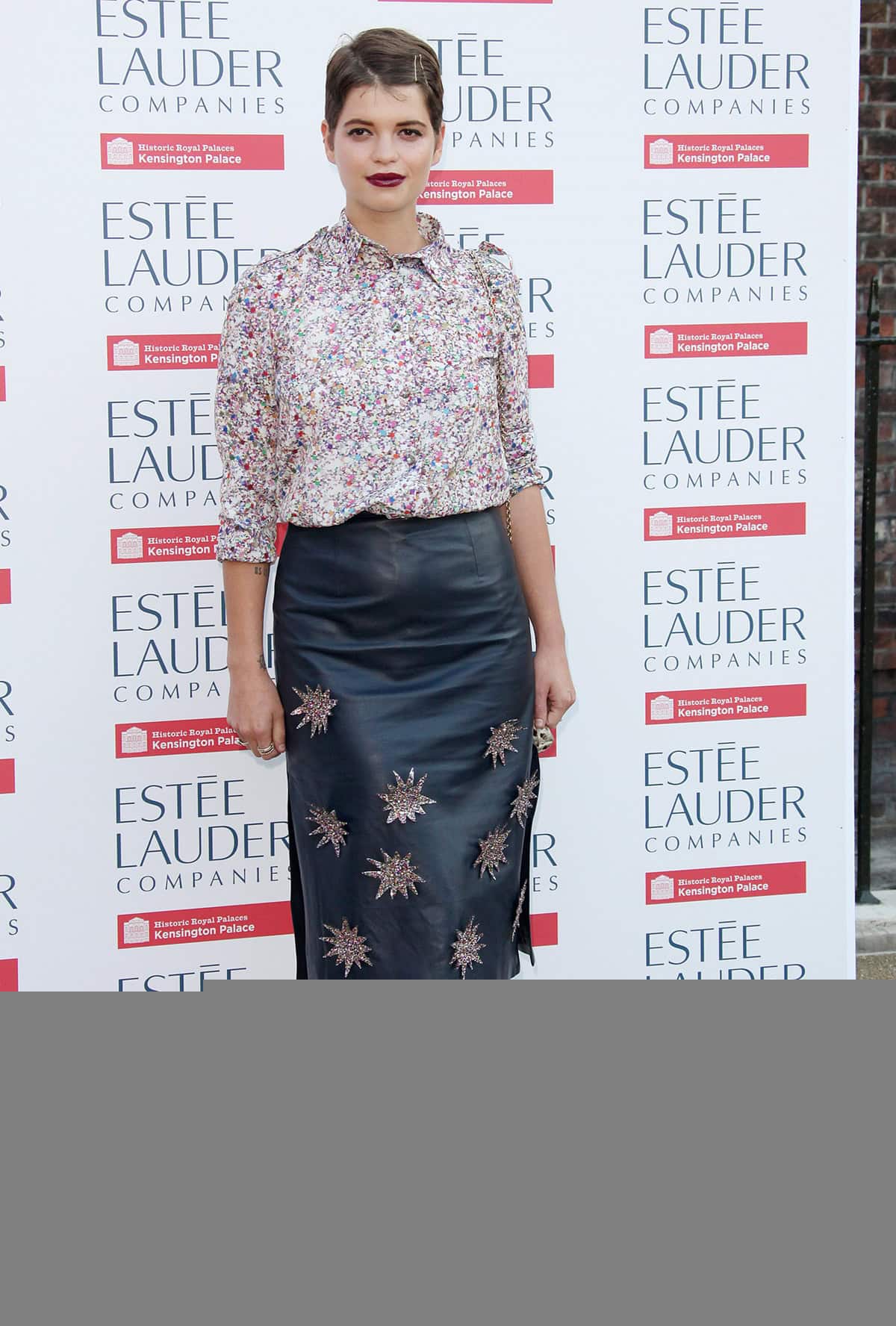 Pixie Geldof enlivened the Fashion Rules exhibition launch at Kensington Palace with a Henry Holland teal leather skirt featuring starburst appliqués, coupled with a print blouse, glam rock silver Mary Janes, and an animal print Dolce & Gabbana bag