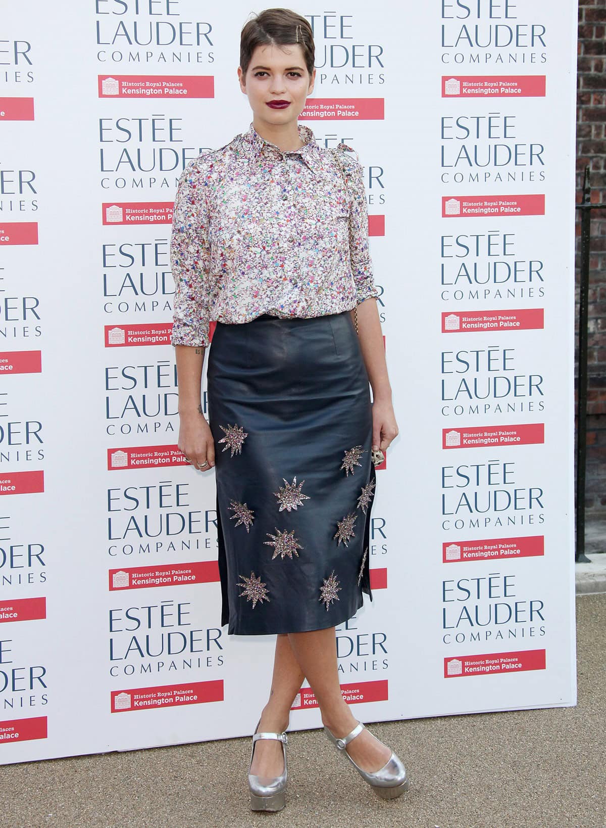 Pixie Geldof enlivened the Fashion Rules exhibition launch at Kensington Palace with a Henry Holland teal leather skirt featuring starburst appliqués, coupled with a print blouse, glam rock silver Mary Janes, and an animal print Dolce & Gabbana bag