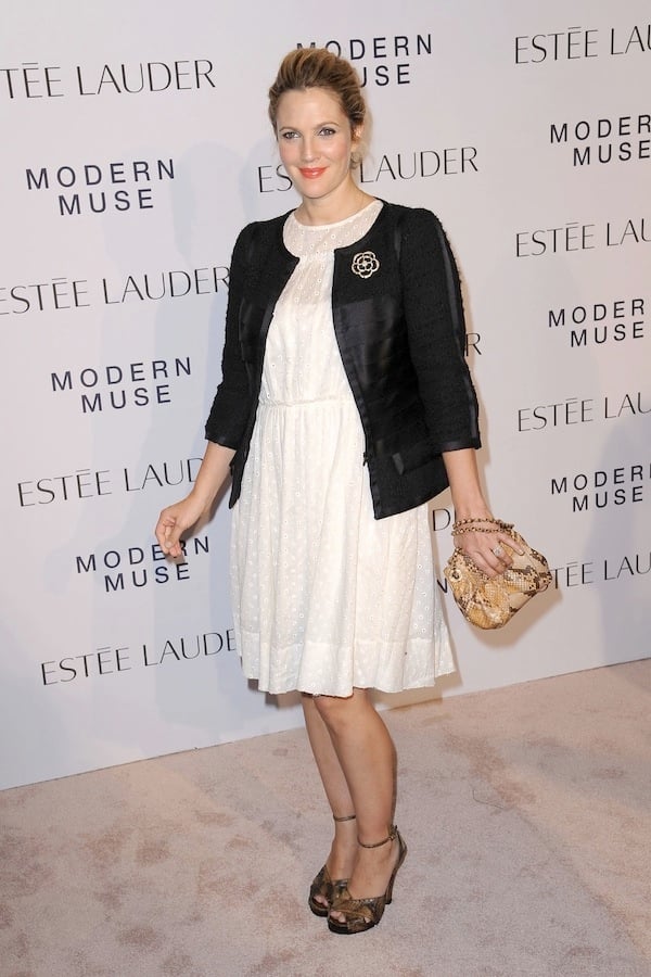 Drew Barrymore flashed her legs in an adorable white dress