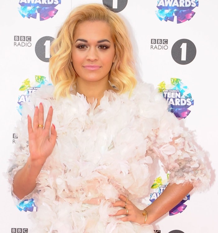 Rita Ora stuns in a textured, feathered white ensemble while attending the BBC Radio 1 Teen Awards