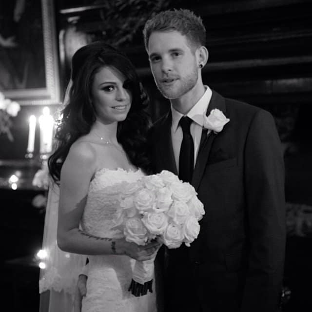 Cher Lloyd and Craig Monk share a romantic moment on their wedding day, with Cher stunning in a strapless lace gown and holding a bouquet of white roses