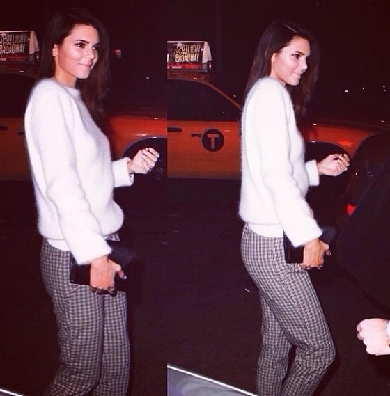 Kendall Jenner wears a cashmere sweater and patterned trousers for the Mario Testino photo exhibit