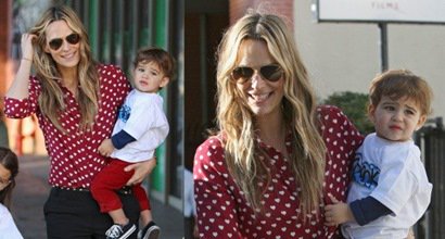 Classy Mommy Molly Sims in Heart-Print Blouse and Black Slacks
