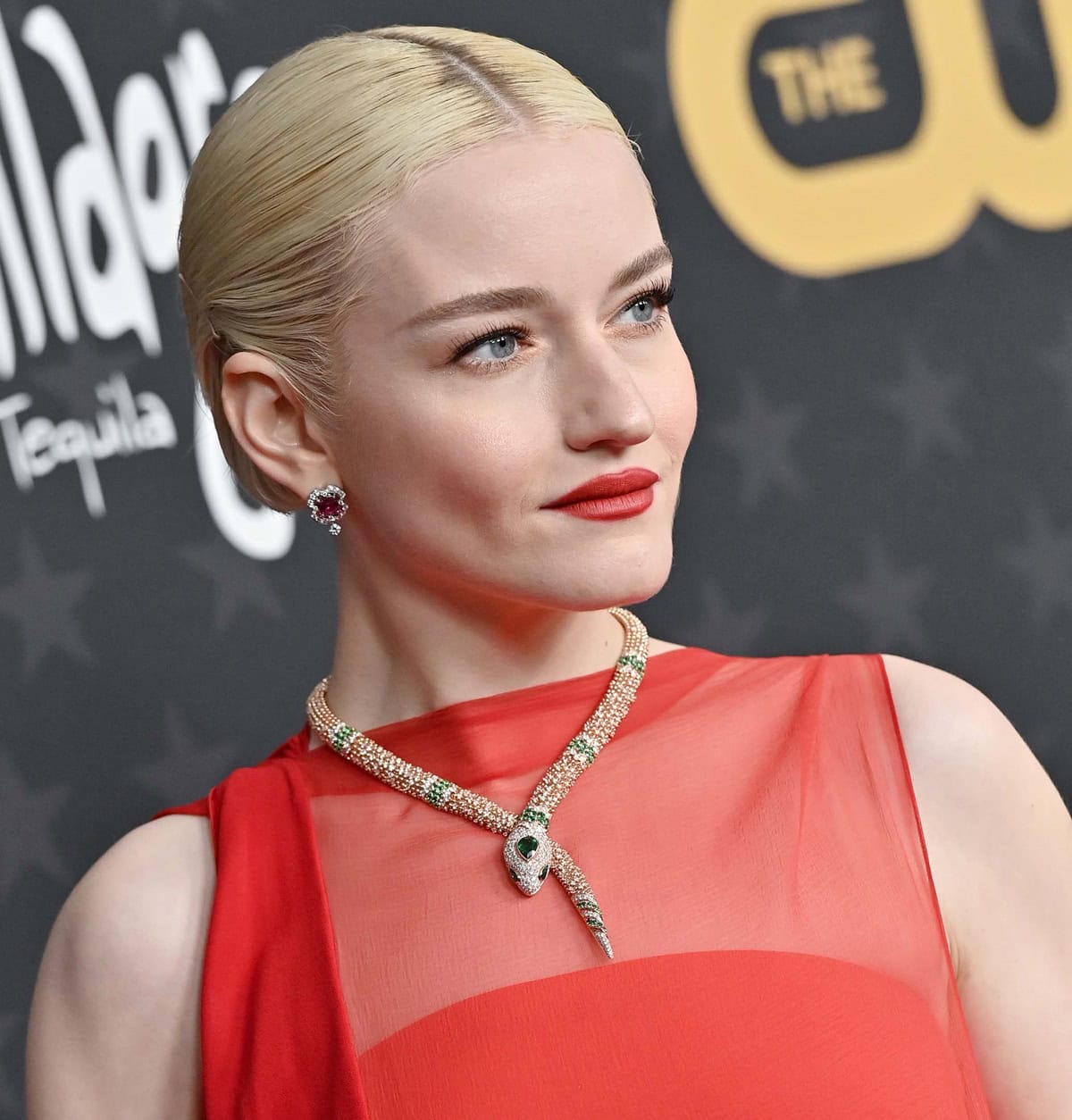 Julia Garner dazzles with her sleek, slicked-back blonde hair and a stunning Bulgari Serpenti necklace at the Critics Choice Awards