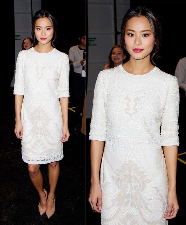 Jamie Chung stuns in a white lace dress at Monique Lhuillier's show during New York Fashion Week Fall 2014 in NYC