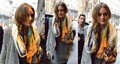 Olivia Palermo wears a chic trench coat with a dress in New York