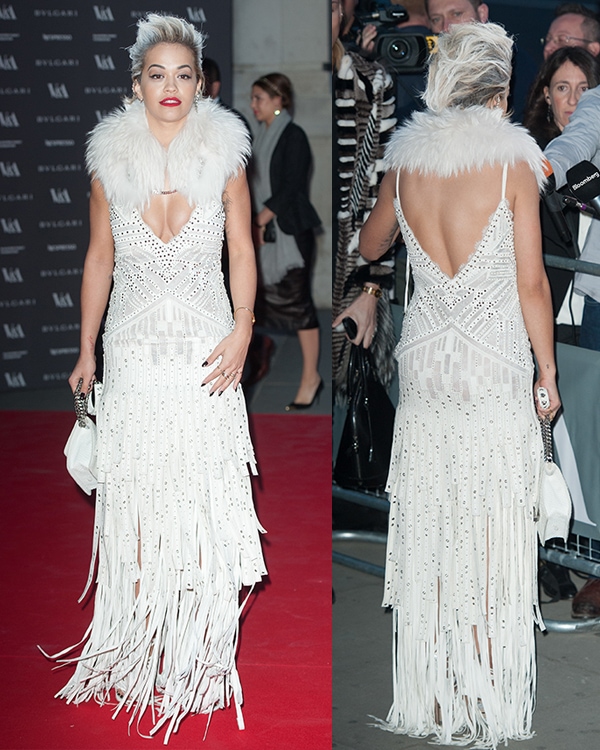 Rita Ora showing off her sprayed white hair while in a Roberto Cavalli dress at the preview of "The Glamour of Italian Fashion" exhibition 