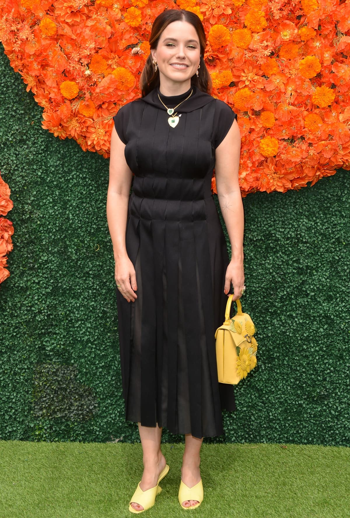 Sophia Bush wears a black Salvatore Ferragamo dress for the 2021 Veuve Clicquot Polo Classic