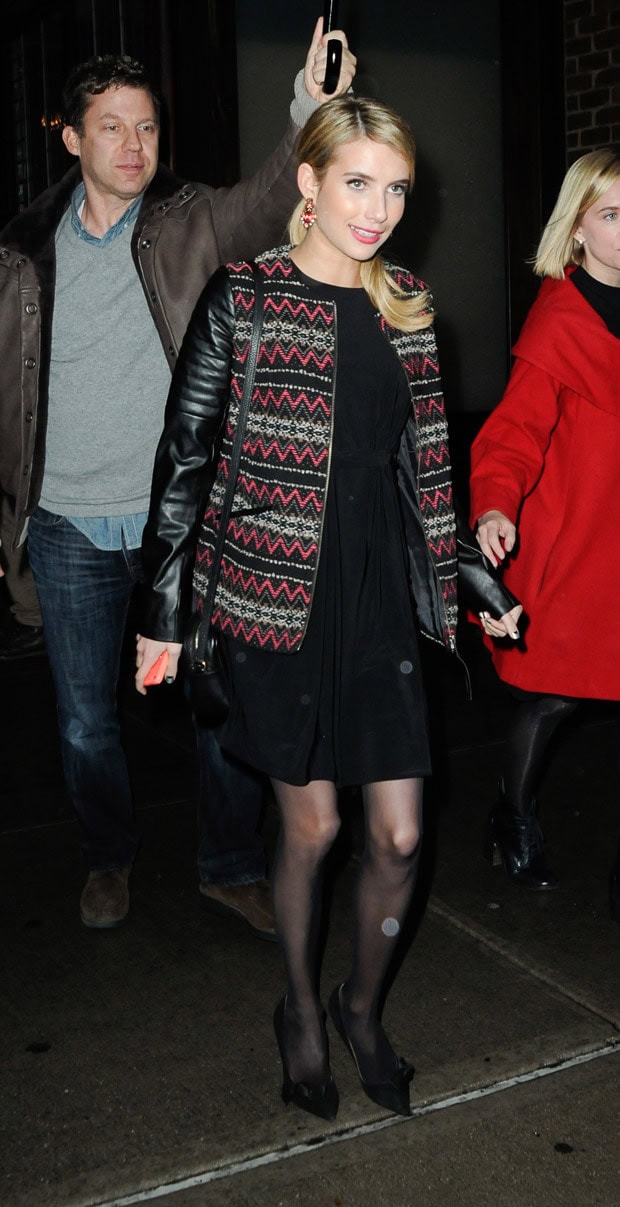 Emma Roberts wearing a T-Bags long-sleeve cutout mini dress on a rainy day in Tribeca, New York City