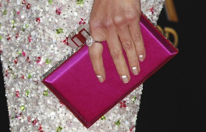 Hilary Swank toting a pink Judith Leiber Couture clutch