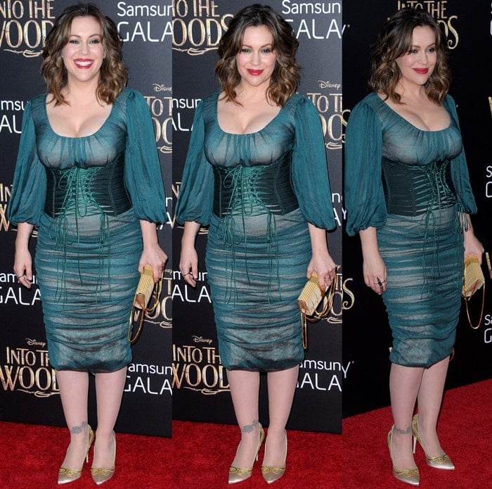 Alyssa Milano donned a dark green ruched chiffon dress from the Dolce & Gabbana Fall 2014 collection