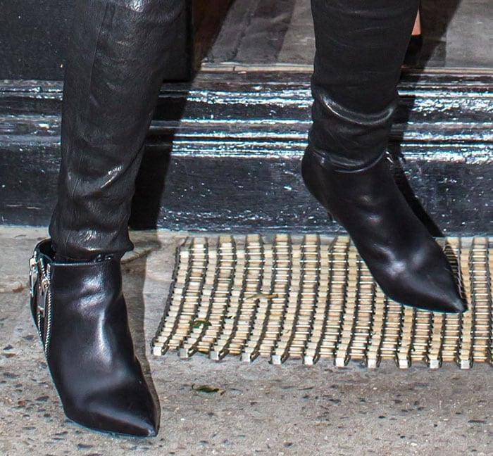 Reese Witherspoon paired her black leather pants with matching ankle boots