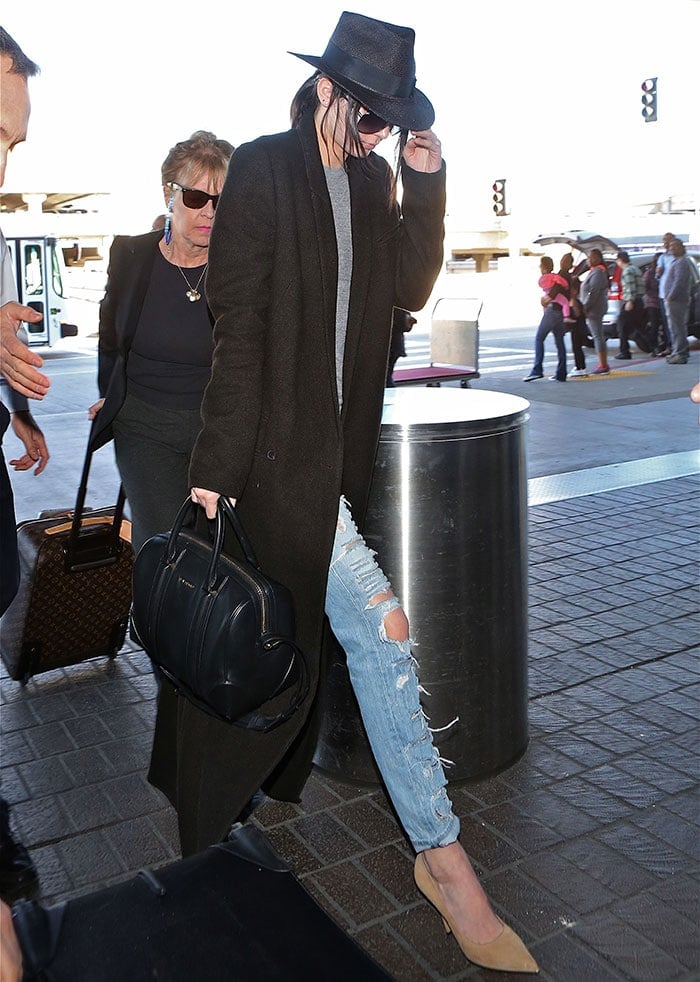 Kendall Jenner departs from Los Angeles International Airport (LAX) carrying a Givenchy 'Lucrezia' bag on January 24, 2015