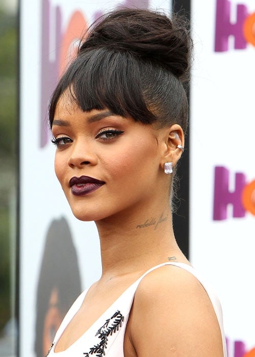 Rihanna's Piled-High Updo With Bangs and Dark Lipstick