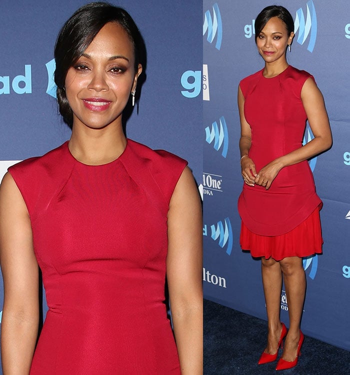 Zoe Saldana tied her hair up in a bun and wore red lipstick