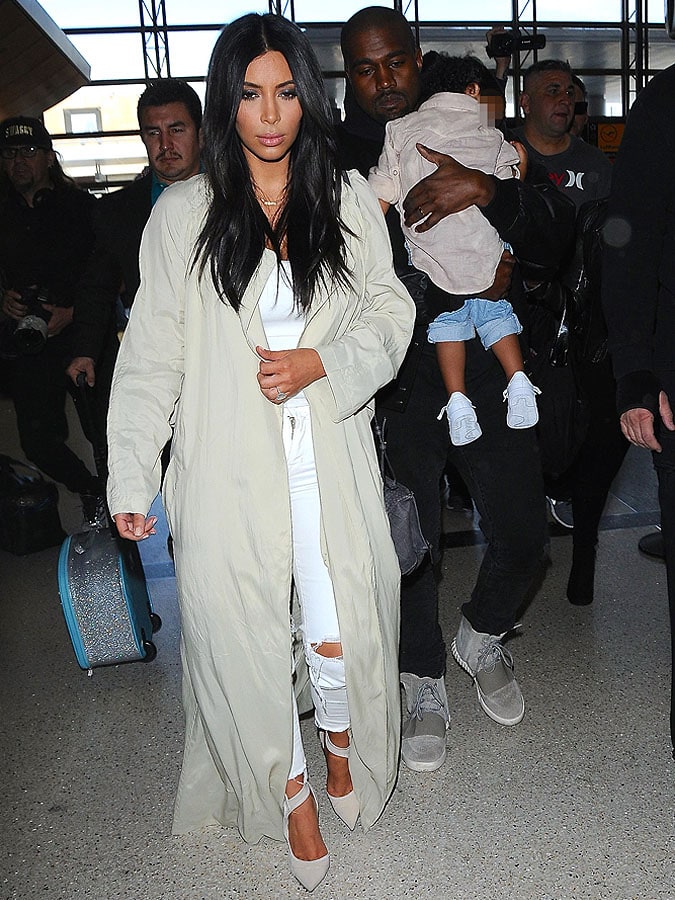 Kim Kardashian and Kanye West Swap Styles and Moods at LAX