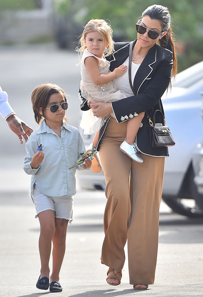 Kourtney Kardashian, Mason Disick, and Penelope Disick on their way to attend the Easter service at West Hills Church in the San Fernando Valley on March 5, 2015