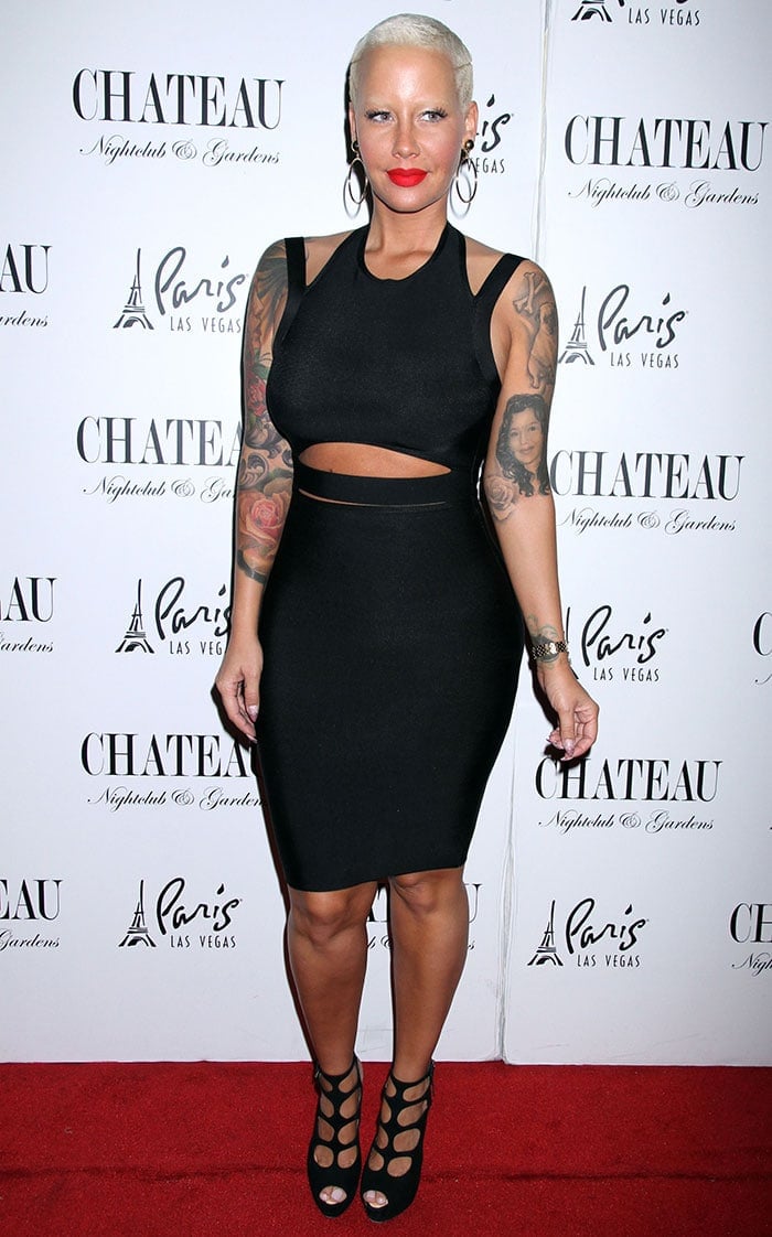 Amber Rose flashes her legs in a curve-hugging LBD featuring cutout details