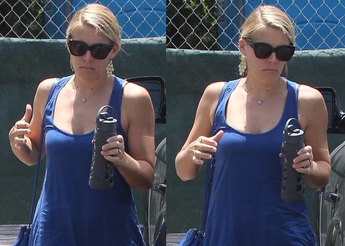 Busy Philipps without makeup toting a rather unique water bottle