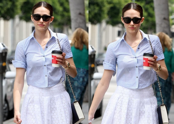 Emmy Rossum wears a pinstriped shirt with rolled up sleeves