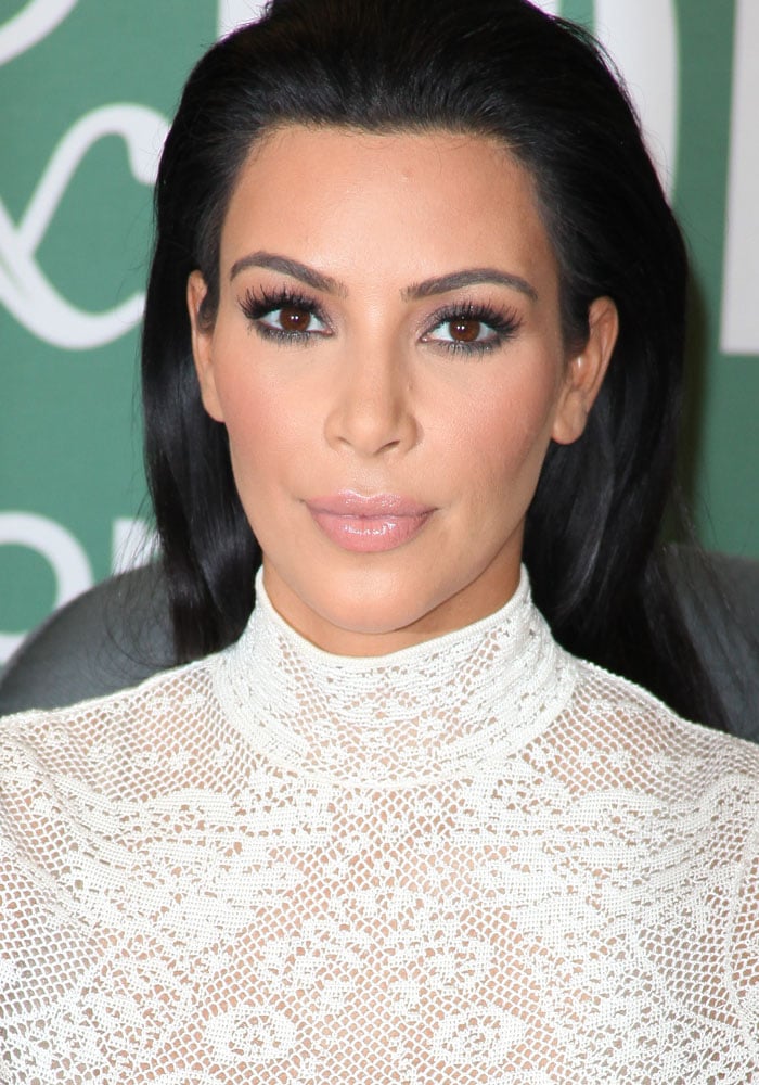 Kim Kardashian kept her hair slicked back and her makeup nude-based