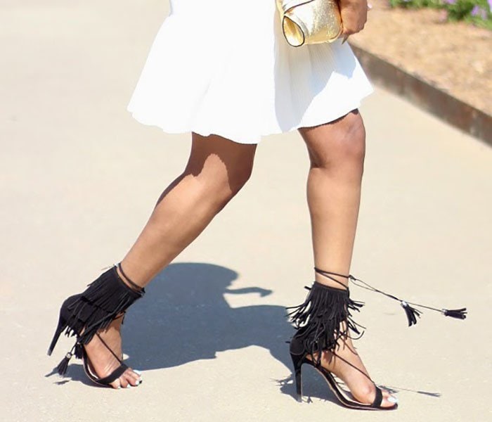 Monica's black fringe sandals