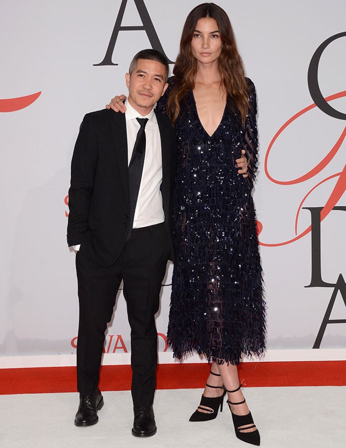 Lily Aldridge posing with American-Thai fashion designer Thakoon Panichgul at the 2015 CFDA Fashion Awards