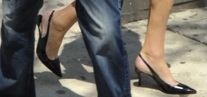 Caitlyn Jenner wearing black slingback pointy-toe pumps