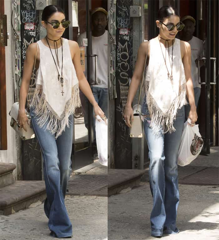 Vanessa Hudgens in a fringed white tank top and flared jeans, embodying a boho-chic vibe