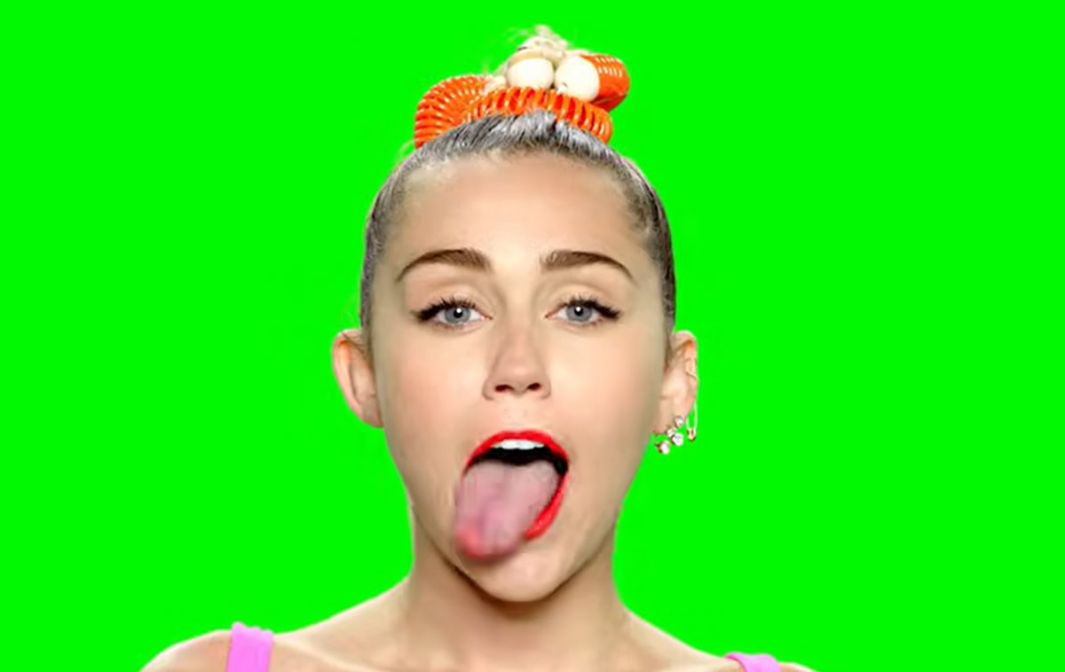 Miley Cyrus strikes a playful pose in her bold MTV VMA 2015 teaser look, showcasing her signature vibrant style and eccentric charm