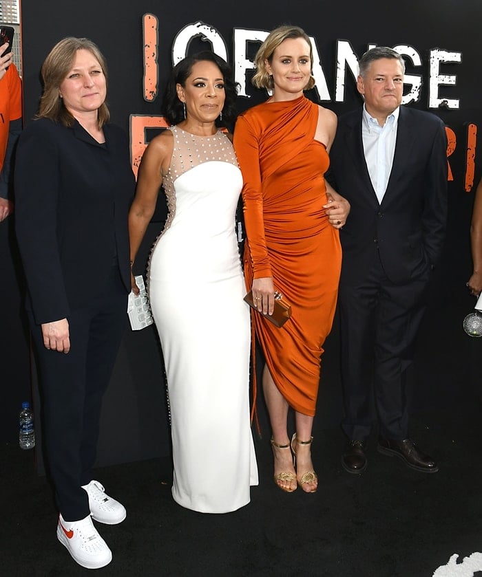 Cindy Holland, Selenis Leyva, Taylor Schilling, and Ted Sarandos walk the red carpet at the Orange Is the New Black final season premiere