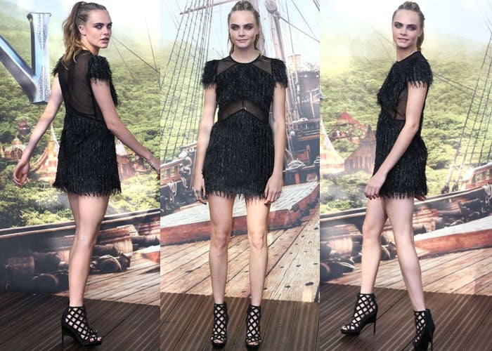 Cara Delevingne shows off her high ponytail and short black dress as she promotes her new movie "Pan"