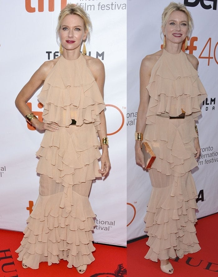 Naomi Watts drowns in beige-colored ruffles as she poses on the red carpet of the Toronto International Film Festival