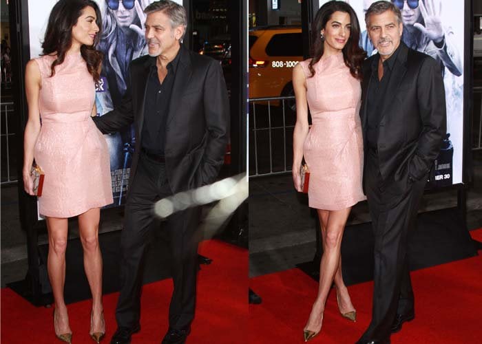 Amal Clooney and George Clooney pose for photos on the red carpet of "Our Brand is Crisis"