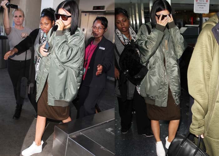 Kylie Jenner strolls through LAX in a Topshop dress and an R13 jacket