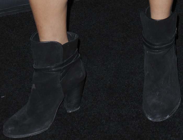 Vanessa Hudgens completes her black carpet look with a pair of AllSaints boots on her feet